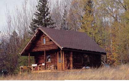 Owner-built, one-room log cabin located at Lake Superior.